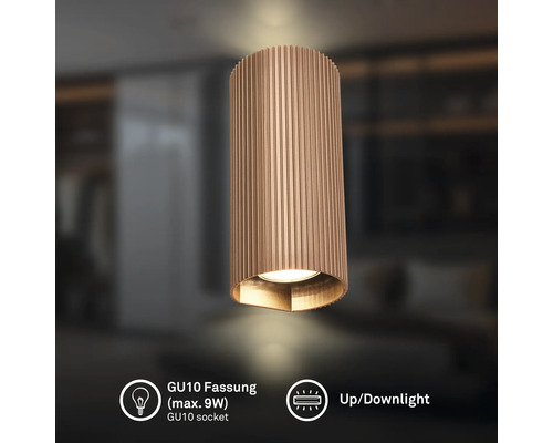 Zylindrische Wandleuchte mit vertikaler Riffelung, GU10 Fassung für maximal 9 Watt, Up- und Downlight-Funktion.