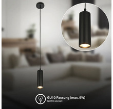 Schwarze zylindrische Pendelleuchte mit geriffelter Struktur, GU10 Fassung für maximal 9 Watt in einem Wohnzimmer.