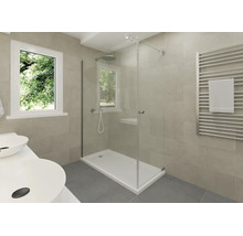 Modernes Badezimmer mit Glasdusche, weißer Duschwanne, Handtuchheizkörper und Doppelwaschtisch vor beigefarbenen Wandfliesen.