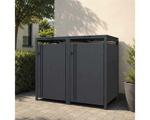 Moderne Mülltonnenbox für zwei Tonnen aus Metall in Anthrazit, im Außenbereich auf Pflastersteinen vor einer Wand aufgestellt.