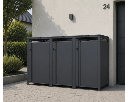 Dreifache Mülltonnenbox aus Metall in Anthrazit, modern gestaltet, platziert auf einer gepflasterten Fläche vor einem Haus.