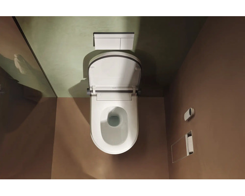Draufsicht auf eine wandhängende Toilette mit offenem Deckel, einer Betätigungsplatte und einem Einbauzubehörhalter im modernen Badezimmer.