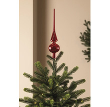 Rote, glänzende Christbaumspitze auf einem grünen Weihnachtsbaum mit kleinen Lichtern.