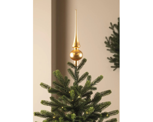 Goldene Christbaumspitze auf einem künstlichen Weihnachtsbaum mit LED-Beleuchtung.