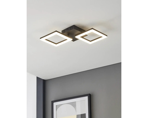 Moderne LED-Deckenleuchte mit zwei quadratischen schwarzen Rahmen, montiert an einer weißen Decke über einer grauen Wand mit gerahmtem Bild.
