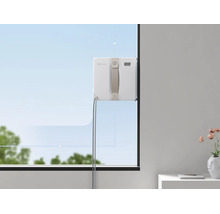 Ecovacs Fensterputzroboter reinigt eine Fensterscheibe mit grafischer Pfadführung