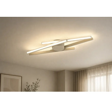 Moderne LED-Deckenleuchte mit überkreuzten Lichtleisten und minimalistischem Design für den Wohnbereich.