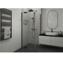 Modernes Badezimmer mit Glas-Duschkabine, schwarzem Duschsystem, weißem Waschtisch, ovalem Spiegel und schwarzem Handtuchheizkörper.