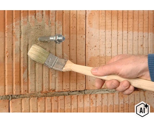 Hand mit einem Heizkörperpinsel reinigt eine Ziegelwand um eine montierte Gewindestange von Staub und Mörtelresten. (Image AI modified or generated)