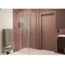Moderne Eckdusche mit Glastür und Armaturen in Metalloptik in einem gefliesten Badezimmer mit Handtuchheizkörper und Waschbecken