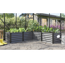 Winkel Hochbeet aus Metall mit bepflanzten Gemüsepflanzen in einem Gewächshaus auf einer Terrasse