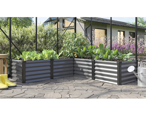 Winkel Hochbeet aus Metall mit bepflanzten Gemüsepflanzen in einem Gewächshaus auf einer Terrasse