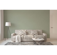 Wohnzimmer mit Sofa, Stehlampe und Teppich