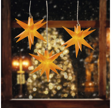 Drei beleuchtete Sterne als Fensterdekoration