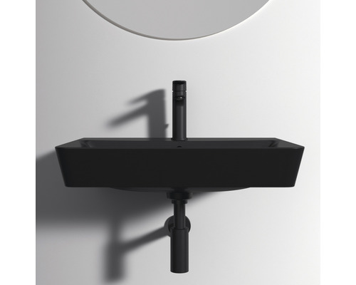 Schwarzes Aufsatzwaschbecken mit Armatur und Siphon vor einer Wand