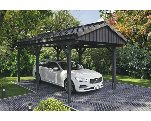 Einzelcarport SKAN Holz Fichtelberg 317 x 566 cm Schiefer Carport mit einem Auto auf einem gepflasterten Stellplatz