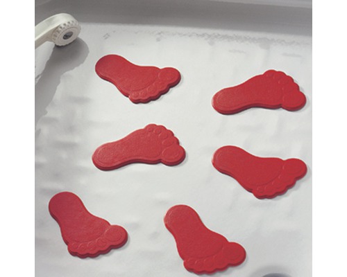 Mehrere Fußabdrücke als Antirutschmatte in einer Dusche.