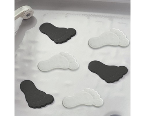 Mehrere Antirutschaufkleber in Form von Füßen in einer Dusche
