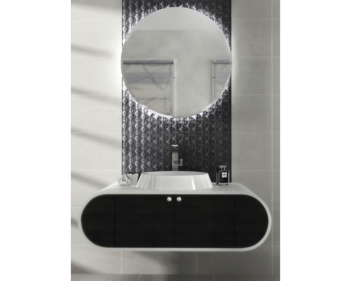 Modernes Badezimmer mit rundem Spiegel, Waschtisch und dunklem Unterschrank.