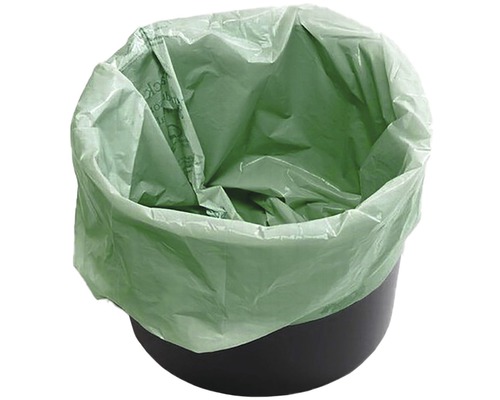 Grüner Bio-Müllbeutel in einem schwarzen Mülleimer