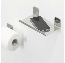 Toilettenpapierhalter mit Ablage aus Metall und Mobiltelefon