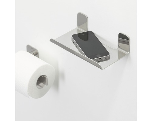Toilettenpapierhalter mit Ablage aus Metall und Mobiltelefon