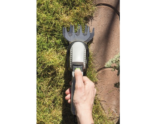 Hand bedient Rasenkantenschneider auf Rasen