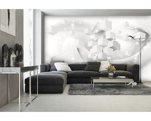 Wohnzimmer mit grauer Couch, Teppich und einer Fototapete mit einem weißen Würfelmuster