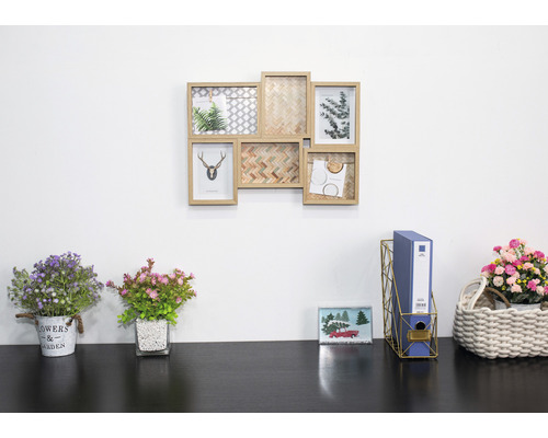 Wanddekoration mit Bilderrahmen und Schreibtischdekoration