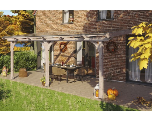 Terrassenüberdachung SKAN HOLZ Rimini 648x300 cm natur Überdachte Terrasse mit Holzbalken, Tisch und Stühlen vor einem Backsteinhaus