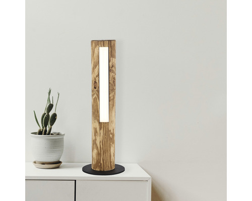 Holz Stehleuchte mit integrierter Beleuchtung auf einem Tisch