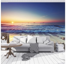 Wohnraumgestaltung mit Fototapete mit Meeresmotiv, inklusive Sofa und Tisch