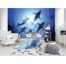 Schlafzimmer mit Fototapete, die eine Gruppe Wale im Ozean darstellt