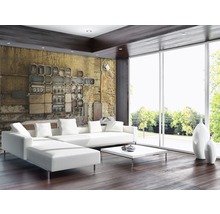 Heller Wohnraum mit Designsofa, Couchtisch und Fototapete mit Schalttafel-Motiv.