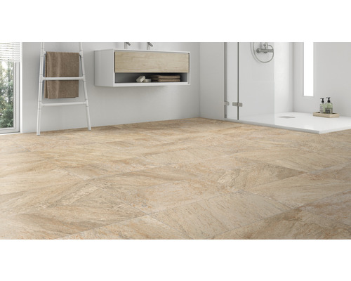 Badezimmer mit Bodenfliesen, Waschtisch und Dusche.