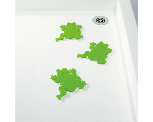Drei grüne Frosch Antirutschaufkleber in einer Dusche.
