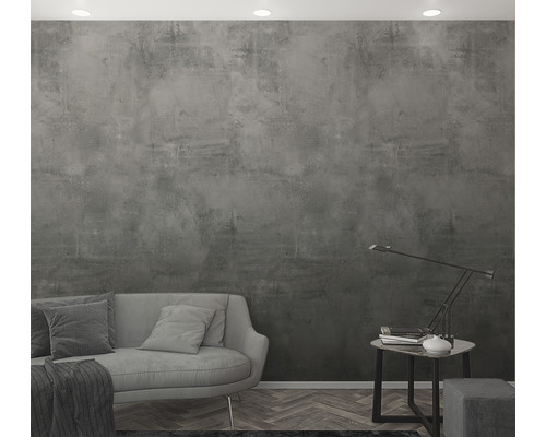 Wohnzimmer mit grauer Betonoptik Tapete, Sofa und Tischlampe