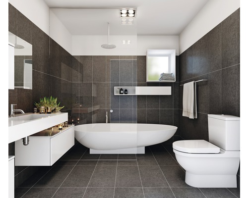 Modernes Badezimmer mit Badewanne, Waschtisch, Toilette und grauen Fliesen
