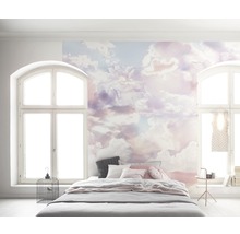 Schlafzimmer mit Wolken-Fototapete und Bett