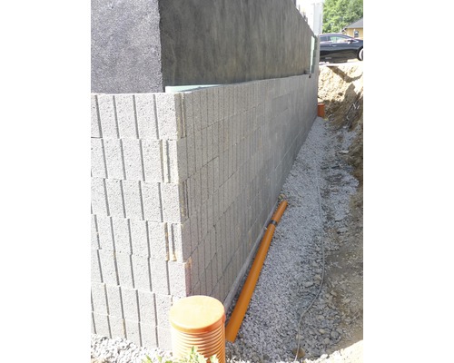 Kellerwandabdichtung mit Isolierung, Drainage und Betonsteinen