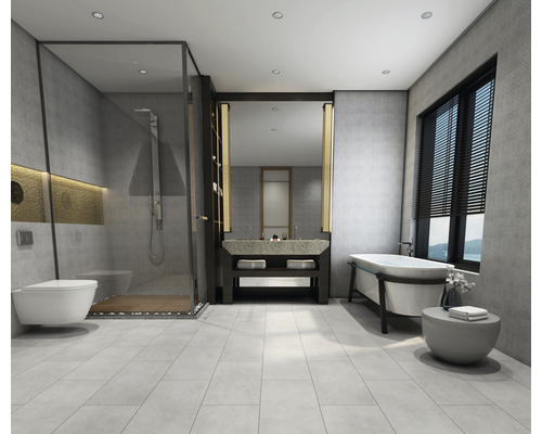 Helles Badezimmer mit Dusche, Waschtisch und Badewanne.