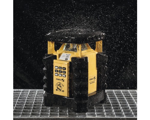 Stabila Laser mit Wasserspritzern auf einem Gitter