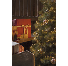 Weihnachtsbaum mit Lichtern, Geschenken und Geschenksack