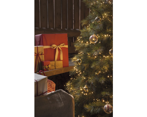 Weihnachtsbaum mit Lichtern, Geschenken und Geschenksack