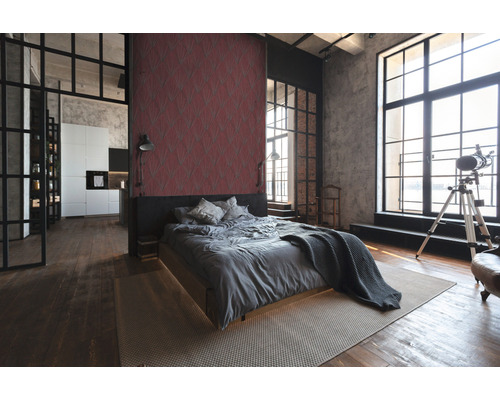 Helles Schlafzimmer im Loftstil mit Bett, Teppich und großem Fenster