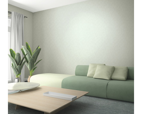 Wohnzimmer mit Sofa, Tisch und Zimmerpflanzen für eine helle und freundliche Atmosphäre.