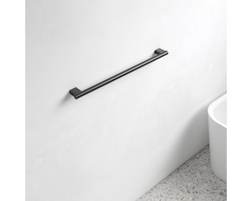 Schwarzer Handtuchhalter an einer Wand montiert.