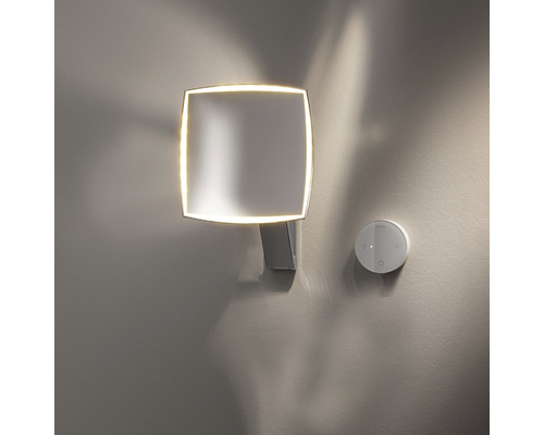 Quadratische Wandleuchte mit runden Ecken und runder Fernbedienung