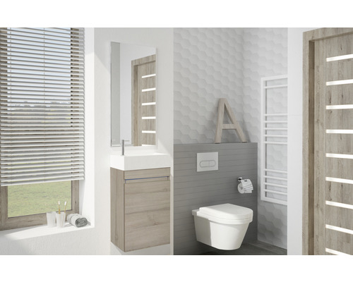 Modernes Badezimmer mit Waschtisch, Spiegel, WC und Heizkörper