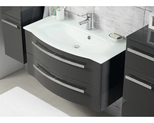 Waschtisch mit Unterschrank, zwei Schubladen, Aufsatzwaschbecken und Armatur im Badezimmer.